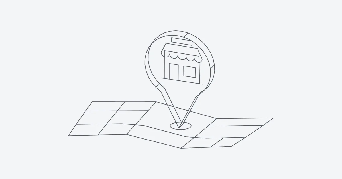 Chincheta de mapa con una tienda dentro clavada sobre un plano de calles